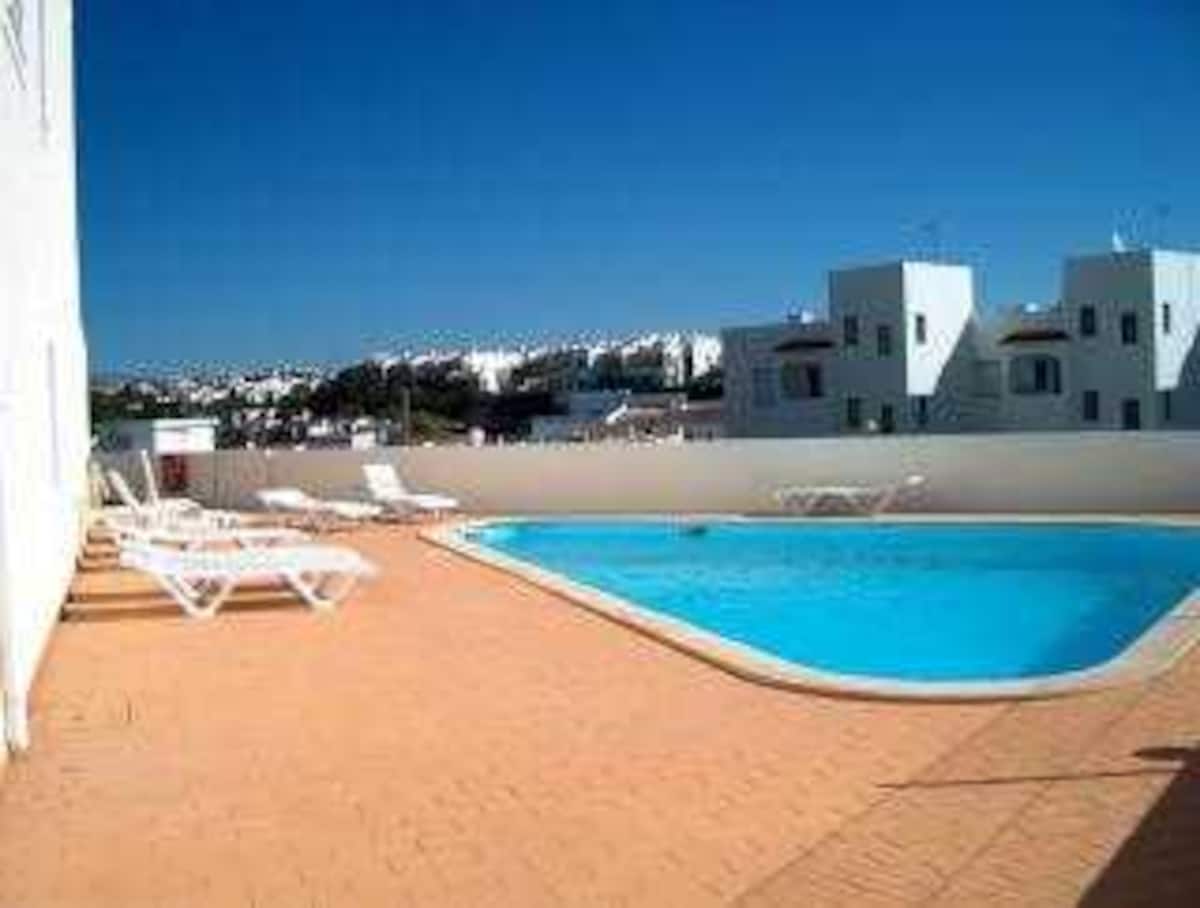 Communal swimming pool and sun terrace