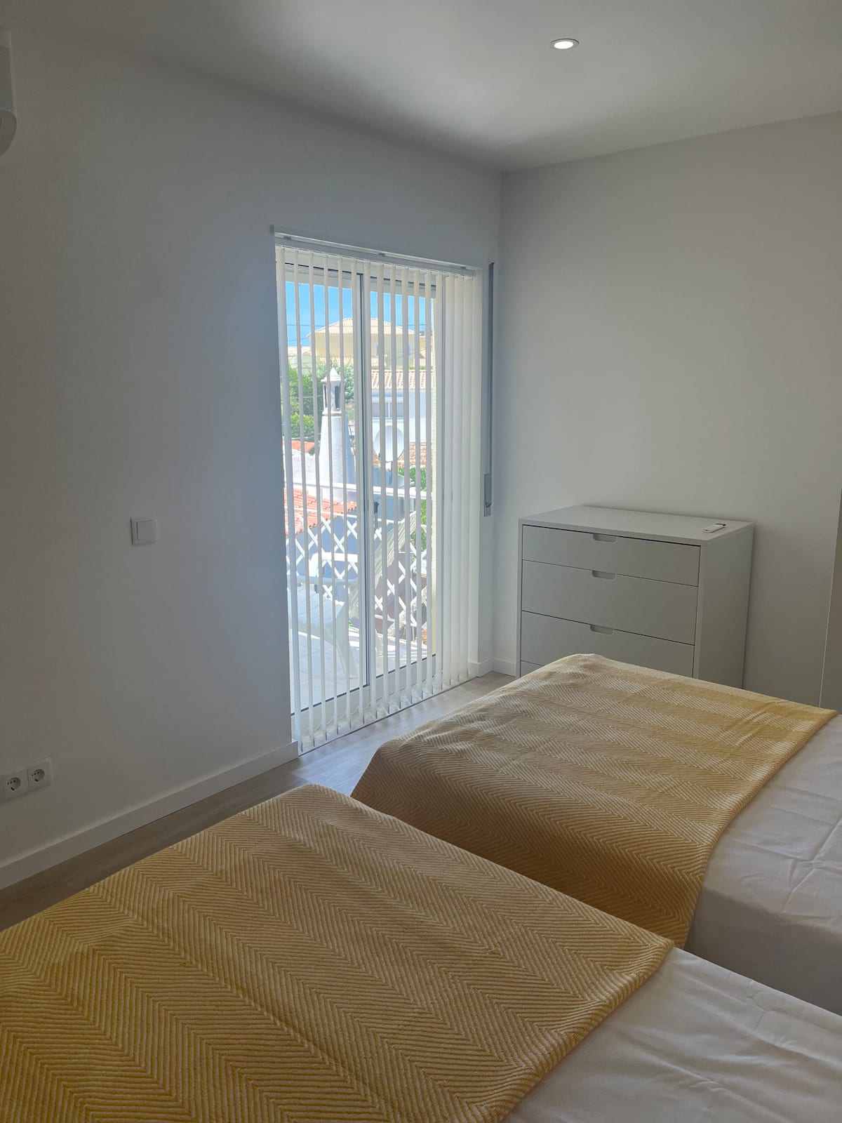 Twin bedroom opening onto its private terrace