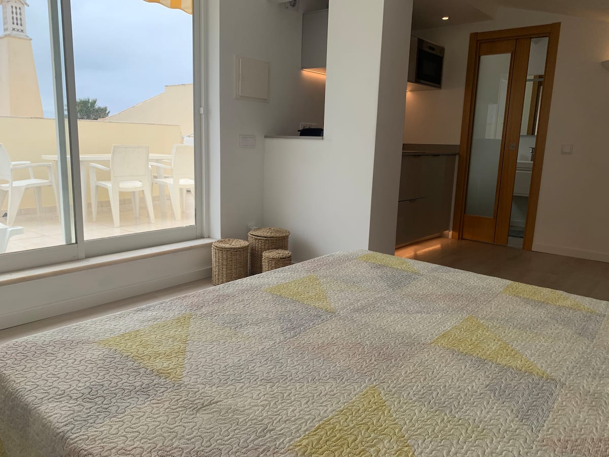 Refurbished studio bedroom and seating