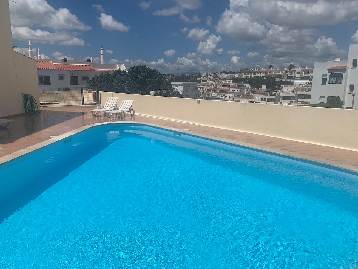 Wide view across the communal pool