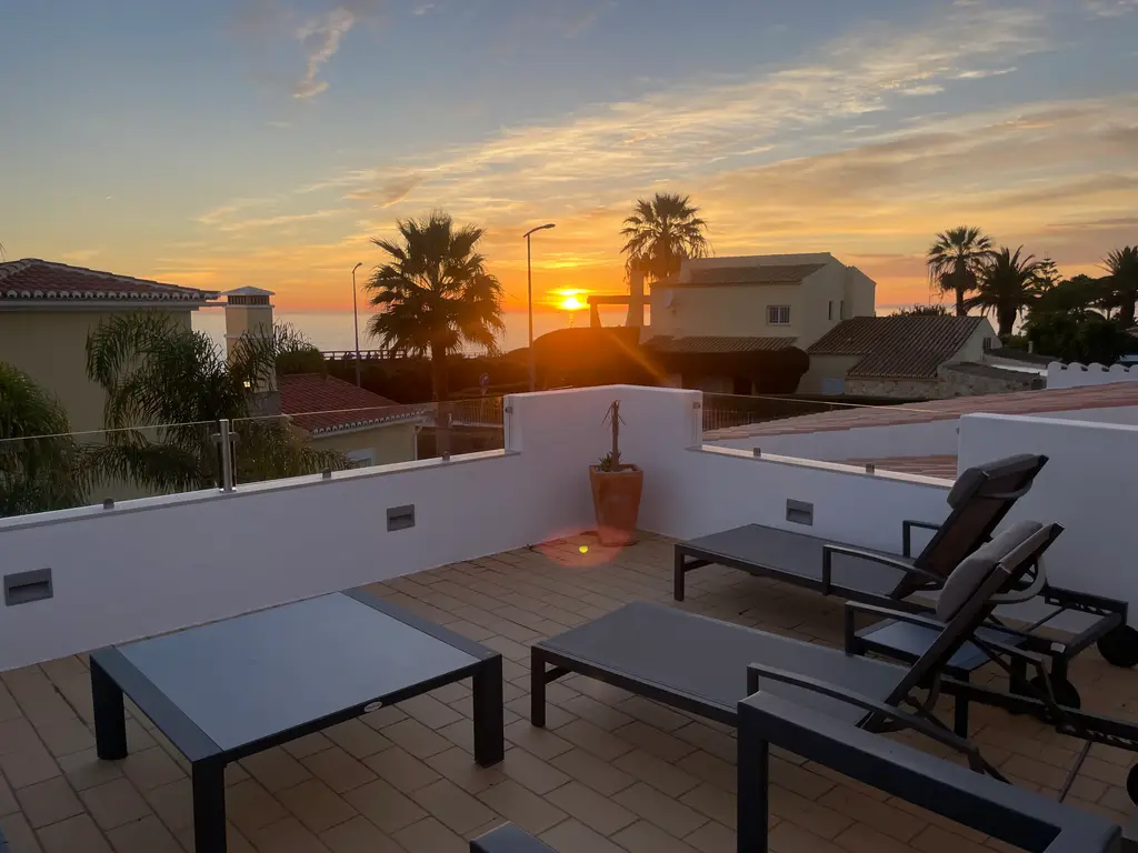 Sunset sea view from the upstairs terrace at Villa Mar e Céu