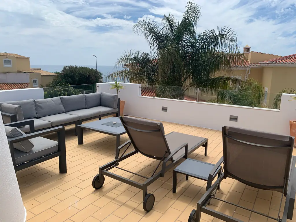 Upstairs terrace with lounge seating and sea views