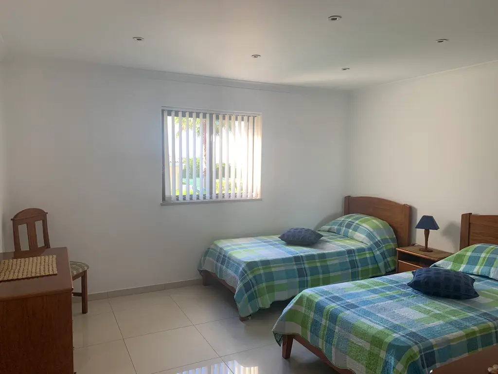 Spacious twin bedroom with storage