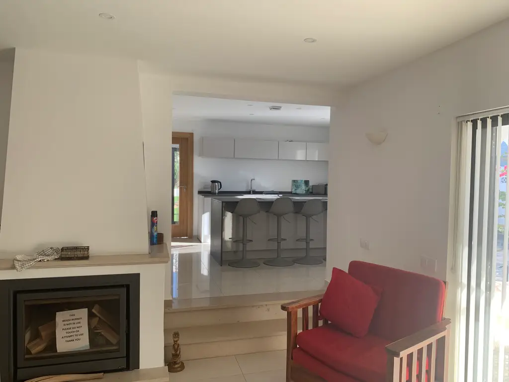 Open-plan lounge leading into the kitchen