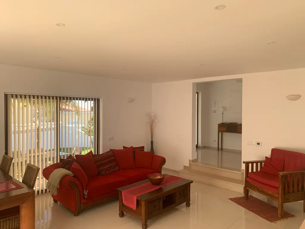 Bright open-plan villa lounge